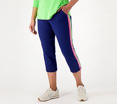 Colorful stripes line the outside of these cropped pants, giving them a sporty vibe that makes them the perfect pick for early morning bike rides or a casual stroll through the neighborhood. From Belle Beach by Kim Gravel. Summer Relaxed Fit Pull-on Capris, Sporty Moisture-wicking Capri Pants, Stretch Versatile Pull-on Capris, Cheap Cotton Pull-on Style Capris, Relaxed Fit Cotton Pull-on Capris, Kim Gravel, Color Block Leggings, Athletic Apparel, Navy Women