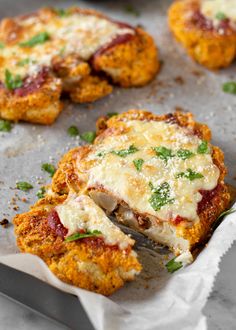 some food that is sitting on top of a pan and has been cut in half