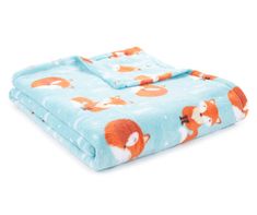 a blue blanket with foxes on it