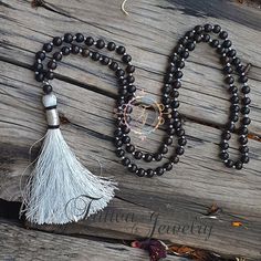 📿Karungali (black ebony wood) is a very powerful tree which our ancestors used. It was used in ancient temples and temple towers (kalasam); was also used in significant homams and other pooja rituals. Ebony Wood Mala is here to remind us to be current and clear-headed so we can make wise and informed decisions. We are being asked to seek new ways to create beauty and harmony that are sustainable for the long-term. This is a time to bring clarity to our intentions as we focus on the future.📿 ✨ Traditional Black Mala With 108 Beads, Handmade Black Mala For Meditation, Handmade Black Mala As Gift, Black Gemstone Beads Mala For Healing, Traditional Black Mala With 8mm Beads, Traditional Black Mala As A Gift, Bohemian Black Beads For Meditation, Black Bohemian Beads For Meditation, Black Bohemian Mala With Gemstone Beads