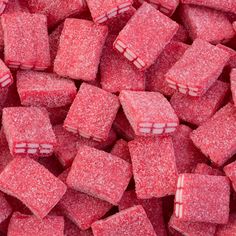 red sugar cubes are piled up together