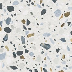 an image of a white and black floor with different colored stones on it's surface