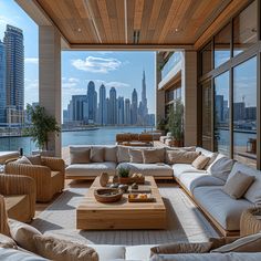 a living room filled with lots of furniture next to a large window covered in windows