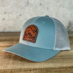 Visit KCLaserCo.com to build and to customize your own hat like this.  Custom designed, laser engraved, and hand stitched to create a one of a kind hat. Features: 60/40 cotton/polyester 100% polyester mesh back Structured, mid-profile, six-panel Pre-curved contrast stitched visor Underbill matches the color of visor Adjustable plastic snapback Leather Snapback Hat, Custom Adjustable Snapback Hat, Custom Adjustable 5-panel Snapback Hat, Custom Handmade Hats For Outdoors, Custom Flat Brim Snapback Hat For Outdoor, Adjustable Six-panel Leather Hat, Custom Adjustable 5-panel Hat, Custom Outdoor Hat With Flat Bill, Custom Adjustable Snapback Hat With Curved Brim