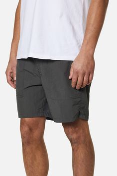 Inspired by one of our original 1970's short designs, the Trails Nylon Short is a favorite in our collection. Made from a lightweight nylon fabric, the Trails Short has a 17" outseam and features an elastic waistband, front patch pocket, back welt pockets, notched side seam hem, faux fly and interior binding. 100% Nylon Front patch pockets Back welt pockets Faux fly Notched side seam hem Interior binding 17" outseam | Trails Nylon Shorts Men's Size X-Large in Black Wash by Katin Nylon Shorts, Designer Shorts, Nylon Fabric, Welt Pockets, Welt Pocket, Patch Pocket, Mens Shorts, Rum, Binding