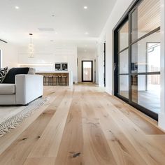 a living room filled with furniture and wooden floors