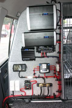 the back end of a car with various electrical equipment in it