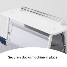 there is a desk with a machine in the middle and an advertise on it