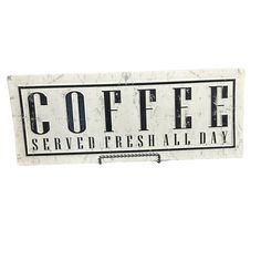 a sign that says coffee served fresh all day