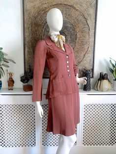 "☆ DESCRIPTION ☆ Beautiful vintage Biba skirt suit from 1969-70. Made from a tea rose colour sateen grosgrain fabric. The jacket is beautifully fitted with wide lapels, patch pockets, slim sleeves and a gathered feature on the back. Midi skirt is a subtle A-line shape. Both jacket and skirt are unlined so perfect for indoor wear.  ☆ CONDITION ☆ Excellent to very good vintage condition. Faults to note: there is a series of tiny dot-like pale marks in the fabric on the lower back and bottom (See last photo) and also some on the back of the right sleeve (see seventh photo). The original owner raised the hemline about 1.5 inches and I have left it \"as is\" since there is likely to be a visible line if lowered again. One of the buttons has the rim partly shear off (see eighth photo). The suit Vintage Tailored Skirt Suit For Spring, Tailored Vintage Skirt Suit For Spring, Retro Fitted Skirt Suit, Biba Fashion, Vintage Skirt Suit, 60s 70s Fashion, 70s Inspired Fashion, Womens Suits, Kensington London