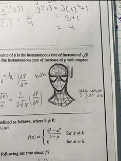 a piece of paper with an image of a spiderman mask and some calculations on it