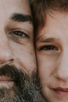 a close up of two people one with a beard and the other with brown eyes