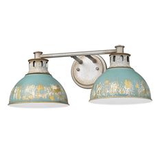 two light bathroom fixture with an old fashioned metal finish and blue glass shades on the top