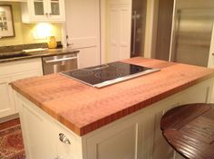 a kitchen island with an oven on it