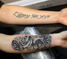 two arm tattoos with roses on them