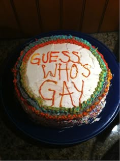 there is a cake that says guess who's gay on the top of it