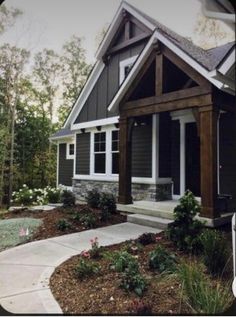 a gray house with white trim and windows