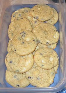 a plastic container filled with cookies on top of a table