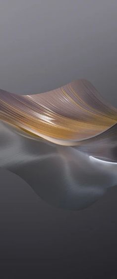 an abstract image of wavy lines in the water on a gray background, with light reflecting off the surface