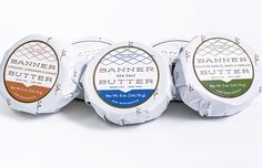 four different types of butter sitting next to each other