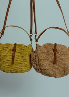 Sans Arcidet's Sam Mini Bag is crafted of natural crocheted raffia and features a tab closure, exterior pockets and a detachable faux leather shoulder strap. Measures approximately 7" x 3" x 6". Color tea. 100% raffia. Lining 100% cotton. Handle 88% polyurethane, 8% polyester, 2% cotton, 2% leather. Made in Madagascar. Jute Crochet Bag With Leather Handles, Crochet Jute Bag With Leather Top Handles, Crochet Jute Bag With Leather Handles, Woven Straw Crossbody Crochet Bag, Woven Straw Crochet Crossbody Bag, Straw Crochet Crossbody Bag, Straw Crochet Crossbody Bag With Adjustable Strap, Beige Crochet Satchel Bag With Detachable Strap, Everyday Use Crochet Crossbody Bag With Detachable Strap