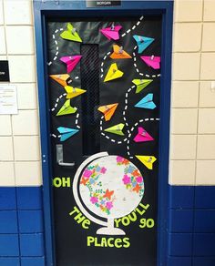 a door decorated with colorful paper airplanes and the words oh the toothy 90 places