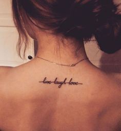 a woman with a tattoo on her back saying, love is all we have to do