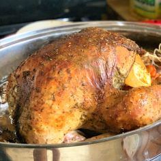 a roasted turkey in a pot on the stove