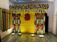 a stage decorated with flowers and candles