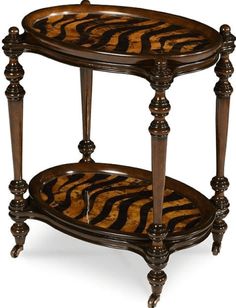 a wooden table with two tiered trays on each side and zebra print top