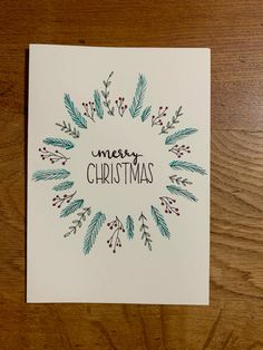 a christmas card with the words merry christmas written in green and red on top of it