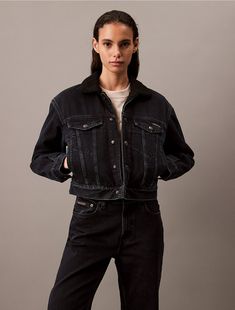 Lined with sherpa, this trucker jacket ensures soft warmth when the temperature drops. Cut in a classic fit and designed with dual chest pockets. Detailed with button closures along the front and shaped with seaming lines.  Material: 80% Cotton, 20% Reprocessed Cotton; Sherpa Lining: 100% Polyester. 90s Straight Jeans, Ck Monogram, Denim Trucker Jacket, Straight Fit Jeans, Trucker Jacket, Jacket Pattern, Monogram Logo, Straight Jeans, Jeans Fit