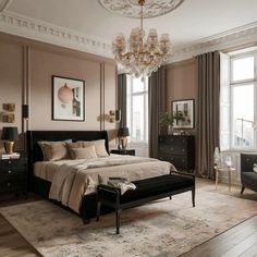 a bedroom with a large bed and chandelier