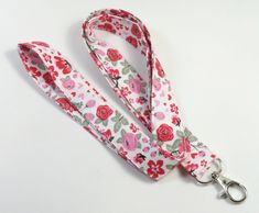 This cute lanyard has beautiful roses on pink design. It is perfect for any occasion. You can leave me a convoy if you need a different size. You can have a wardrobe of lanyard to match your outfit. This lanyard is made of soft 100% cotton fabric to give a comfortable feel around your neck. This lanyard is easy to take care. You can spot clean and throw in a washer and hang dry. If you want you can iron and it is ready to use. These lanyards are perfect if you have metal allergy. Each of these l Lanyard Pink, Pink Lanyard, Cute Lanyard, Fabric Keychain, Cute Lanyards, Fabric Lanyard, Roses Pink, Have Metal, Pink Design