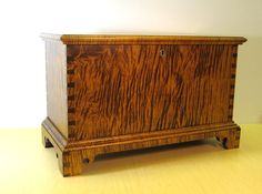 a wooden cabinet sitting on top of a table