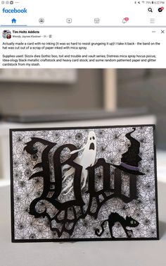 a halloween card with the word ghost on it and a spooky black cat