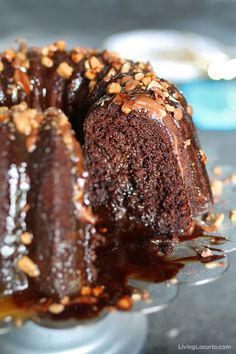 a chocolate bundt cake with nuts on top