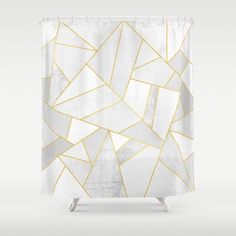 the shower curtain is white and has gold foil on it, with an abstract design