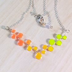 Why choose between daywear and nightwear when you can have both? This glow-in-the-dark necklace effortlessly transitions from everyday chic to glow party glamour. Shine bright anytime, anywhere! Everyone should own one of these fun and unique glow in the dark resin necklace. The sweet little droplets look bright and cheerful during the day and glow up when you enter a dark room or under black light.  The necklace is hand made, using silver brass wire, glow powder, and resin. Each necklace is uni Cruise Theme Party, Cruise Theme Parties, Cruise Theme, Glow In The Dark Resin, Rave Jewelry, Dark Necklace, Blacklight Party, A Dark Room, Light Jewelry