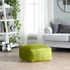 a living room filled with furniture and a clock on the wall