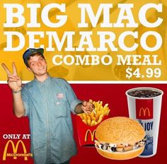 a man standing next to a big mac and french fries in front of a mcdonald's sign