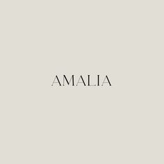 the word amalia written in black ink on a light gray background with white lettering