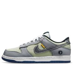 Nike Union has teamed up with Dunk Low to release a special "Passport Pack" of shoes, inspired by the travel and adventure of the Union crew. The "Pistachio" colorway is a modern take on an early 2000s release, highlighted by ripstop textile construction and unfinished contrast stitching. The semi-translucent tearaway layer reveals contrasting green and navy hues on the leather underlay. Unique branding elements include a yellow "UN/LA" tag and Union's Frontman logo on the lateral heel. These sneakers are perfect for those who love to travel in style and comfort. Order your pair today! Nike Green Custom Sneakers For Outdoor, Functional Green Custom Sneakers For Streetwear, Green Functional Custom Sneakers For Streetwear, Urban Nike Custom Green Sneakers, Nike Urban Custom Green Sneakers, Nike Urban Green Custom Sneakers, Unique Branding, Dunk Low, Travel Style