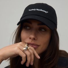 Looks great running errands, looks better as a gift. Featuring an embroidered *Actively Manifesting* and a black inner brim to protect your hat from sweat & makeup. One size fits all. FINAL SALE Black Curved Bill Dad Hat For Spring, Adjustable Brimmed Dad Hat For Everyday, Black Curved Brim Baseball Cap For Spring, Black Curved Brim Dad Hat For Spring, Black Curved Bill Hat For Spring, Black Curved Brim Baseball Cap, Black Dad Hat With Letter Print, Curved Bill Black Hat For Spring, Black Visor Hat With Letter Print