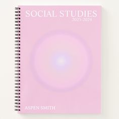 a spiral notebook with the words social studies written in white and pink on top of it