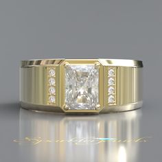 a gold ring with a princess cut diamond surrounded by smaller round diamonds on the sides