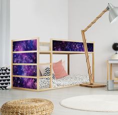 there is a bunk bed with space on the side and stars in the sky behind it