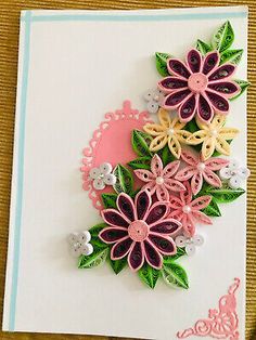 a handmade card with flowers on it