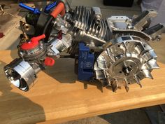 a close up of an engine on a wooden table