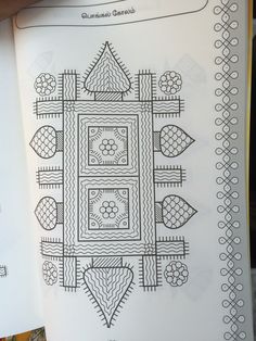 an open coloring book with designs on it